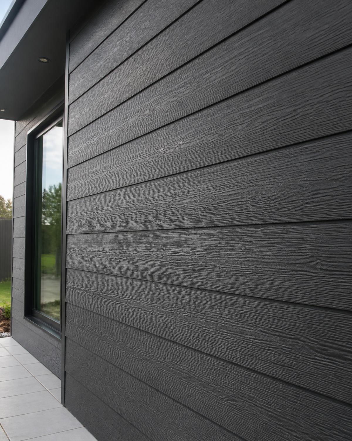 Charcoal composite cladding boards on a contemporary building elevation